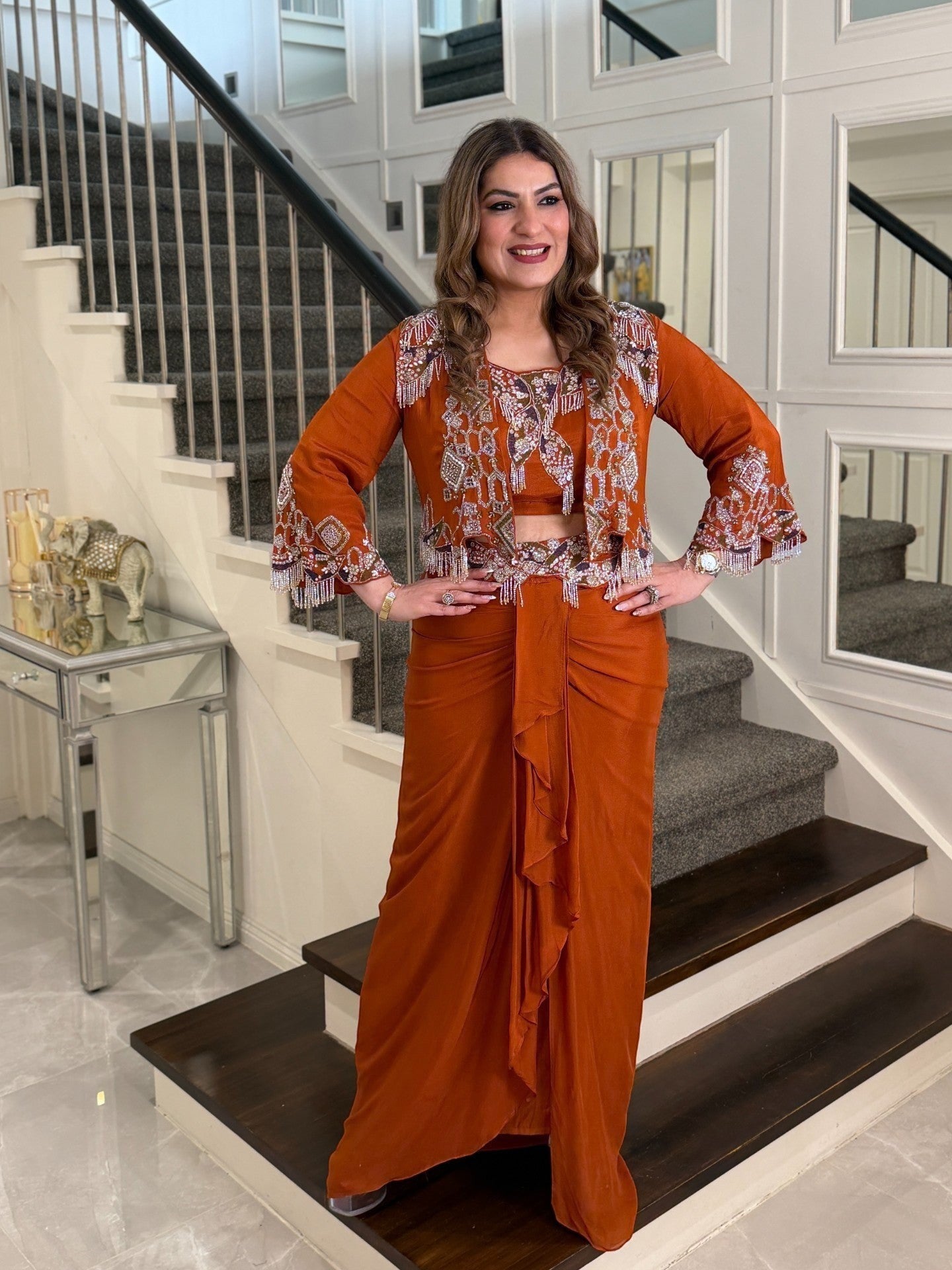 PanacheByDivya rust orange Indo-western outfit with beaded jacket and draped skirt for festive occasions