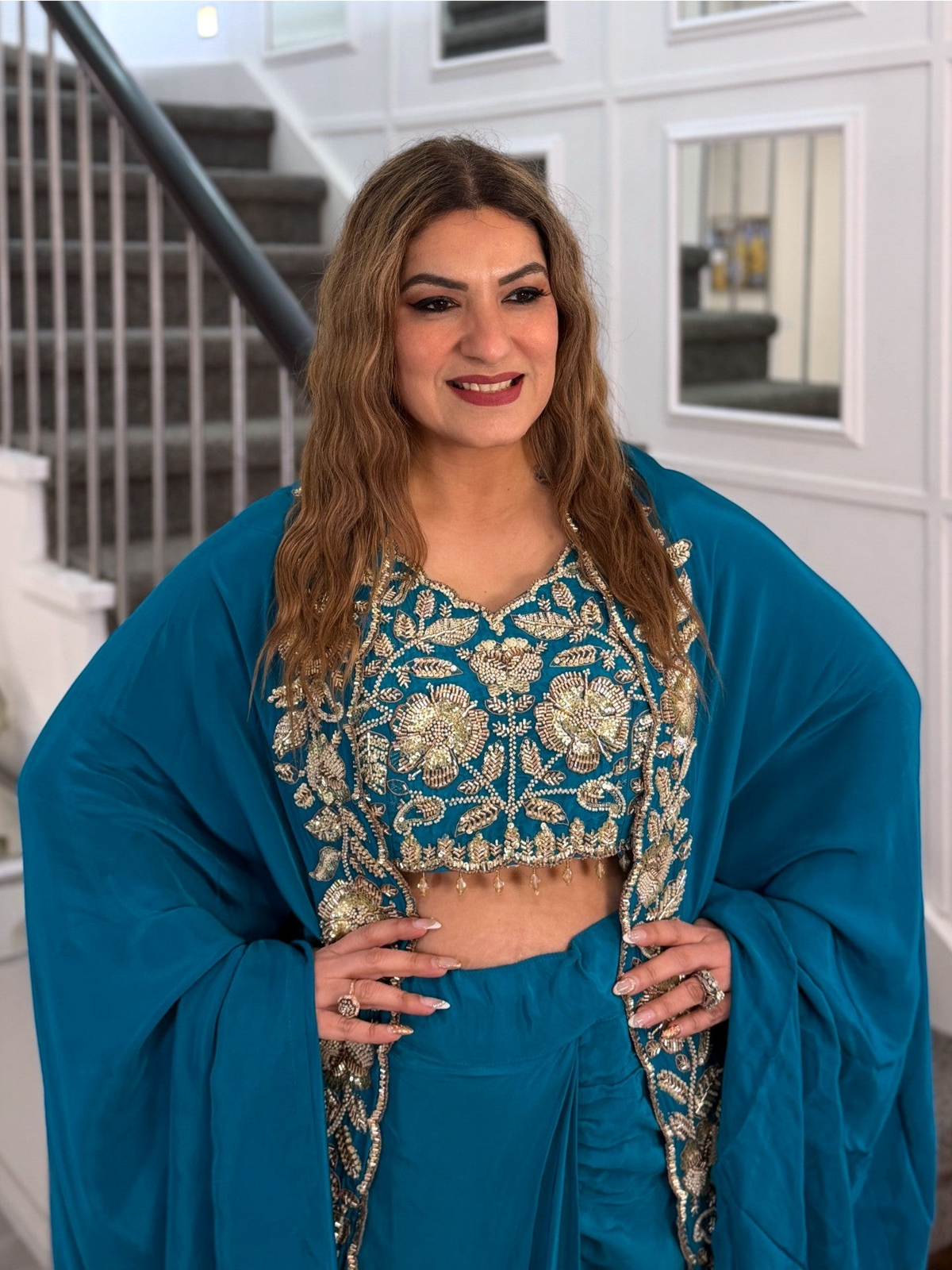 PanacheByDivya teal indo-western outfit with intricate gold floral embroidery, featuring a crop top and draped skirt.