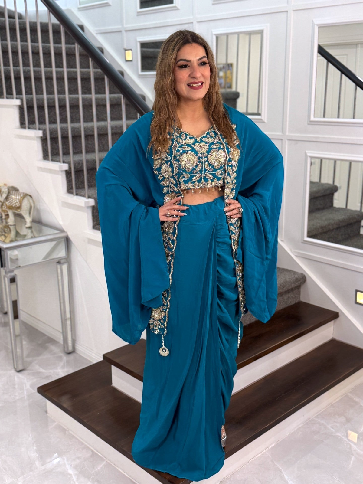 PanacheByDivya teal Indo-western outfit with embroidered crop top, draped skirt, and matching cape for parties